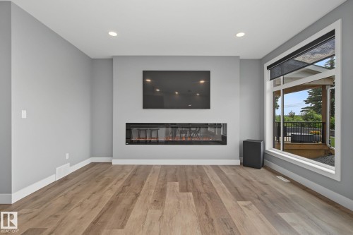 1463 Howes Crescent Sw, Edmonton, AB - Indoor Photo Showing Living Room With Fireplace