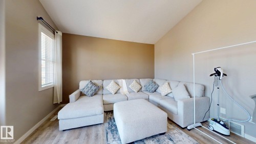 Spacious interior with vaulted ceilings, wood-finish flooring, and neutral wall tones - 335 62 Street Sw, Edmonton, AB - Indoor Photo Showing Living Room
