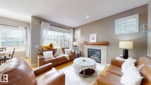Living room - 335 62 Street Sw, Edmonton, AB - Indoor Photo Showing Living Room With Fireplace