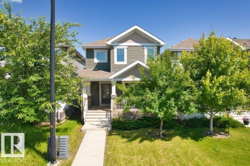 Two-story residence featuring dark green siding and white trim - 1627 167 Street Sw, Edmonton, AB - Outdoor