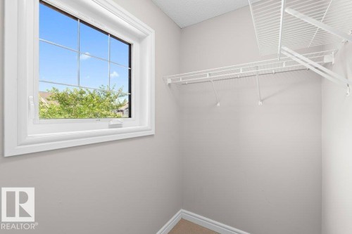 Windowed closet space featuring white wire shelving - 1627 167 Street Sw, Edmonton, AB - Indoor