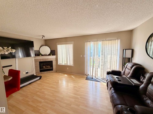13834 37 Street Nw, Edmonton, AB - Indoor Photo Showing Living Room With Fireplace