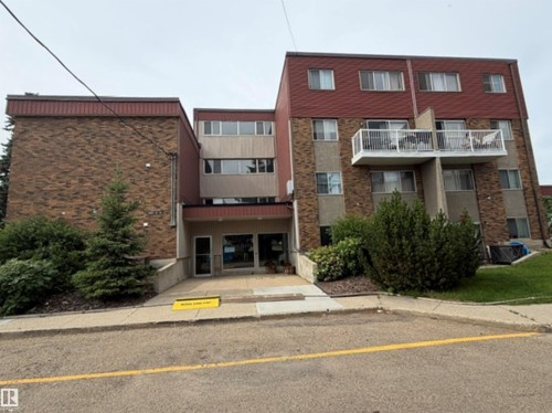 Multi-level building exterior featuring brick and paneling finishes - #108 4501 51 St, Leduc, AB - Outdoor