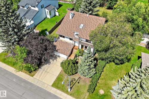 Residential property featuring a shingle roof, a front-facing attached garage, and a concrete driveway - 4208 Ramsay Road Nw, Edmonton, AB - Outdoor