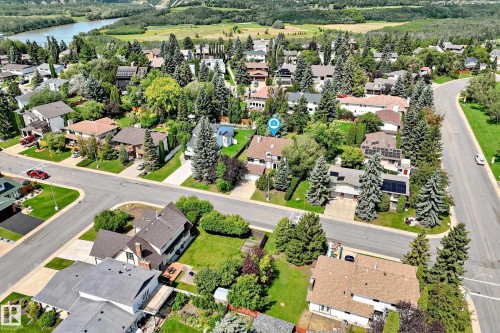 Residential neighborhood featuring mature trees and a curvilinear street design - 4208 Ramsay Road Nw, Edmonton, AB - Outdoor With View