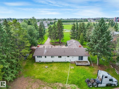 Single-story residence featuring a white exterior and a brown shingle roof - 10912 5 Avenue Sw, Edmonton, AB - Outdoor