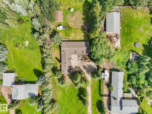 Expansive property featuring lush green lawns and mature trees - 10912 5 Avenue Sw, Edmonton, AB - Outdoor With View