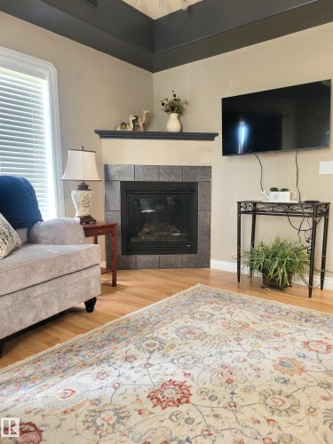 #101 4128 47 St, Drayton Valley, AB - Indoor Photo Showing Living Room With Fireplace