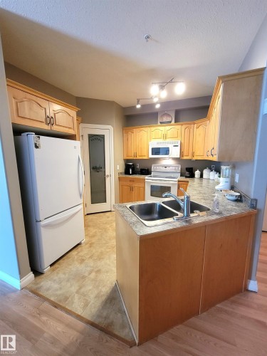 #101 4128 47 St, Drayton Valley, AB - Indoor Photo Showing Kitchen With Double Sink