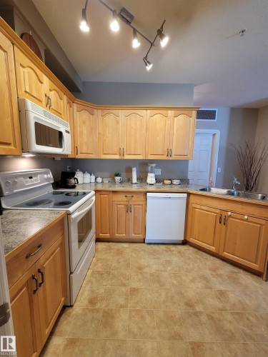 #101 4128 47 St, Drayton Valley, AB - Indoor Photo Showing Kitchen With Double Sink