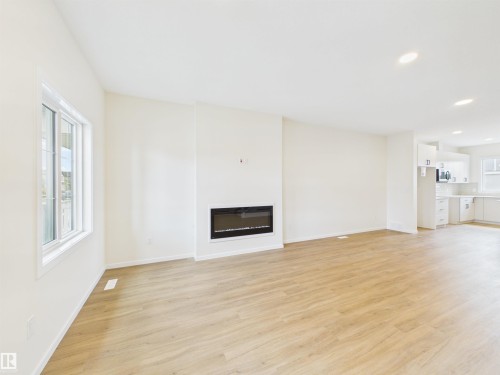 1096 Mcleod Avenue, Spruce Grove, AB - Indoor Photo Showing Living Room With Fireplace