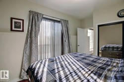 Sliding glass door with vertical blinds and drapery panels - 