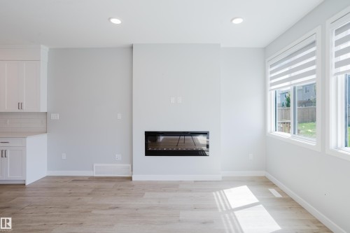3883 Chrustawka Place Sw, Edmonton, AB - Indoor Photo Showing Living Room With Fireplace