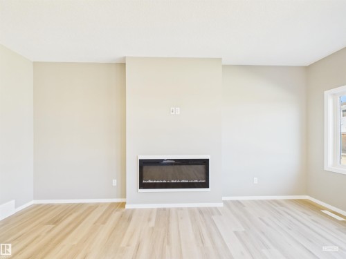 119 Hilton Cove, Spruce Grove, AB - Indoor Photo Showing Living Room With Fireplace