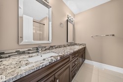 Dual vanity featuring integrated sinks and polished chrome faucets - 