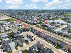 Residential neighborhood featuring diverse architectural styles and mature landscaping - 