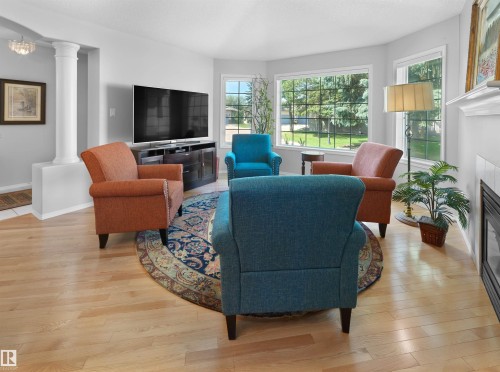 #124 215 Blackburn Dr E Sw, Edmonton, AB - Indoor Photo Showing Living Room With Fireplace