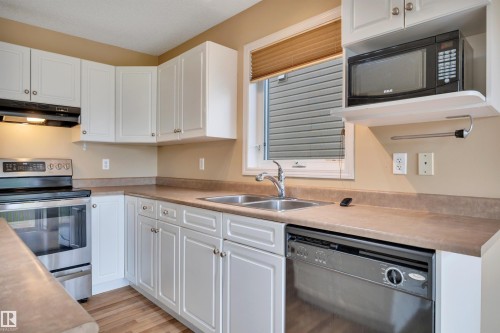 #82 287 Macewan Dr Sw Sw, Edmonton, AB - Indoor Photo Showing Kitchen With Double Sink