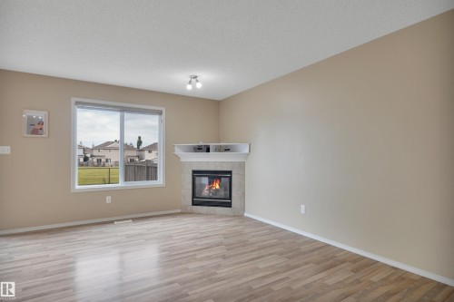 #82 287 Macewan Dr Sw Sw, Edmonton, AB - Indoor Photo Showing Living Room With Fireplace