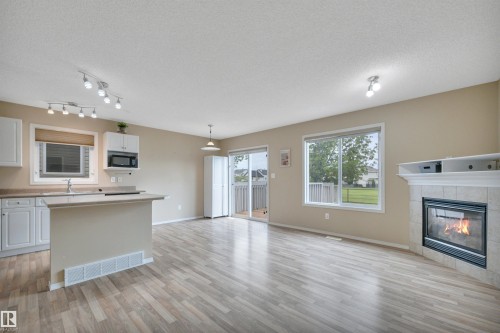 #82 287 Macewan Dr Sw Sw, Edmonton, AB - Indoor Photo Showing Other Room With Fireplace