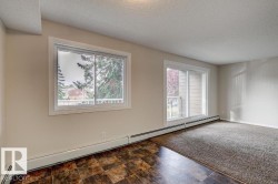 Spacious room featuring a large window and sliding glass door - 