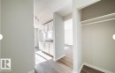 Entryway featuring a built-in closet with shelving and hanging rod - 3312 105 Avenue Northwest, Edmonton, AB  - Indoor Photo Showing Other Room 