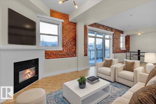 #406 10728 82 Av Nw, Edmonton, AB - Indoor Photo Showing Living Room With Fireplace
