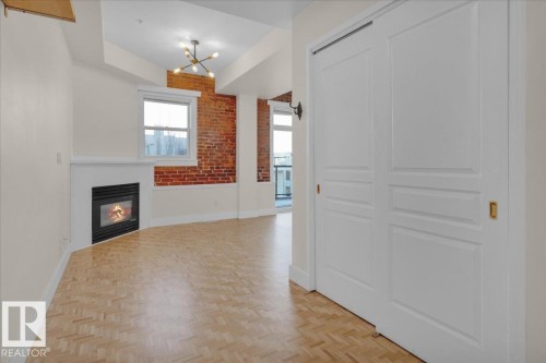 #406 10728 82 Av Nw, Edmonton, AB - Indoor Photo Showing Other Room With Fireplace