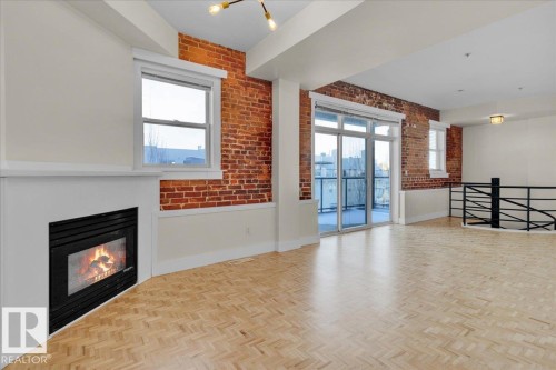 #406 10728 82 Av Nw, Edmonton, AB - Indoor With Fireplace