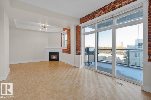 #406 10728 82 Av Nw, Edmonton, AB - Indoor With Fireplace