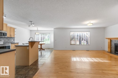 Living Room With Big Window Looking Out Into The Huge Backyard. - 4717 60 Street, Beaumont, AB 