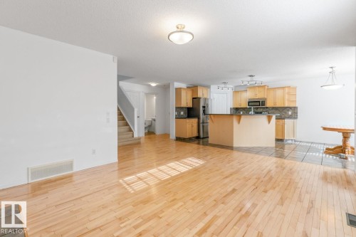 View From Living Room Looking Into Kitchen & Eating Area. - 4717 60 Street, Beaumont, AB 