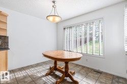 Eating Area With Big Window Looking Into Backyard. - 