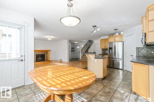View From Eating Area Looking Into Kitchen And Living Room. - 4717 60 Street, Beaumont, AB 
