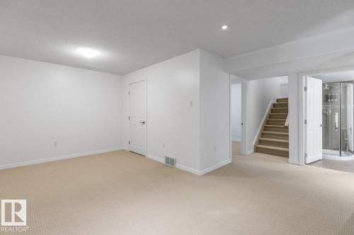 View Of Staircase To The Basement Into The Recreation Room. - 4717 60 Street, Beaumont, AB 
