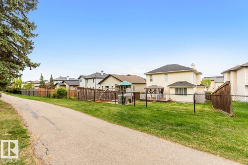 View Of The Back Of The House & Yard From The Walkway. - 4717 60 Street, Beaumont, AB 