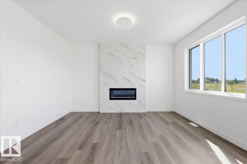 5221 47 Ave, Calmar, AB - Indoor Photo Showing Living Room With Fireplace