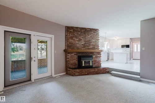3936 72 Street Nw, Edmonton, AB - Indoor Photo Showing Living Room With Fireplace