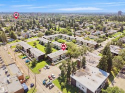 Aerial perspective showcasing a residential area with multi-unit buildings - 