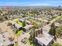 Aerial perspective showcasing a residential area with multi-unit buildings - 10446 55 Avenue Nw, Edmonton, AB  - Outdoor With View 
