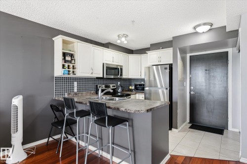 #418 17404 64 Av Nw, Edmonton, AB - Indoor Photo Showing Kitchen With Double Sink