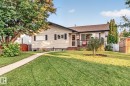 Exterior featuring light-colored siding, dark shutters, and a brown shingle roof - 5307 104 Avenue Nw, Edmonton, AB  - Outdoor 