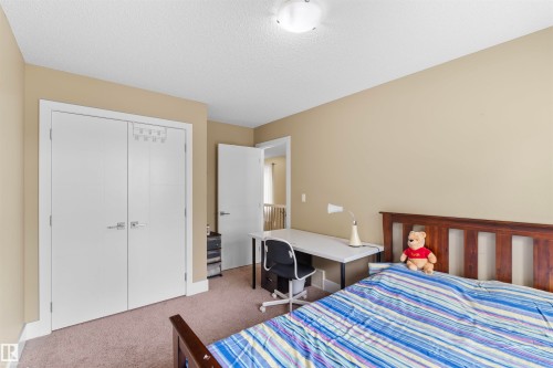 Room featuring neutral-toned walls and carpeted flooring - 11719 127 Street Nw, Edmonton, AB - Indoor Photo Showing Bedroom