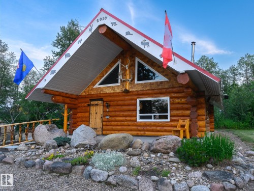 Log cabin exterior featuring a prominent A-frame roofline with an extended soffit - 58227 Range Rd 70 A, Rural St. Paul County, AB - Outdoor With Exterior