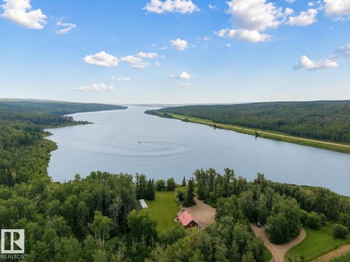 Expansive water frontage with mature tree coverage - 58227 Range Rd 70 A, Rural St. Paul County, AB - Outdoor With Body Of Water With View