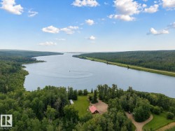 Expansive water frontage with mature tree coverage - 