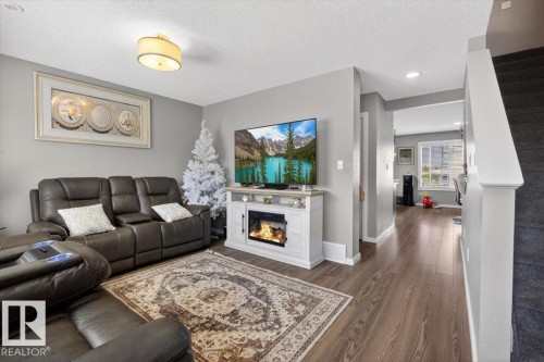 23 2215 24 Street, Edmonton, AB - Indoor Photo Showing Living Room With Fireplace