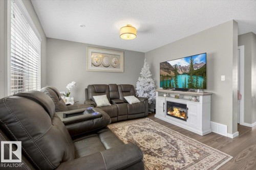 23 2215 24 Street, Edmonton, AB - Indoor Photo Showing Living Room With Fireplace