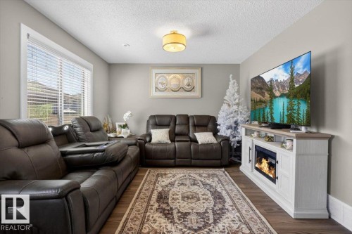 23 2215 24 Street, Edmonton, AB - Indoor Photo Showing Living Room With Fireplace