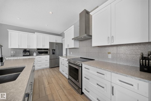 7640 179 Avenue Nw, Edmonton, AB - Indoor Photo Showing Kitchen With Stainless Steel Kitchen With Double Sink With Upgraded Kitchen